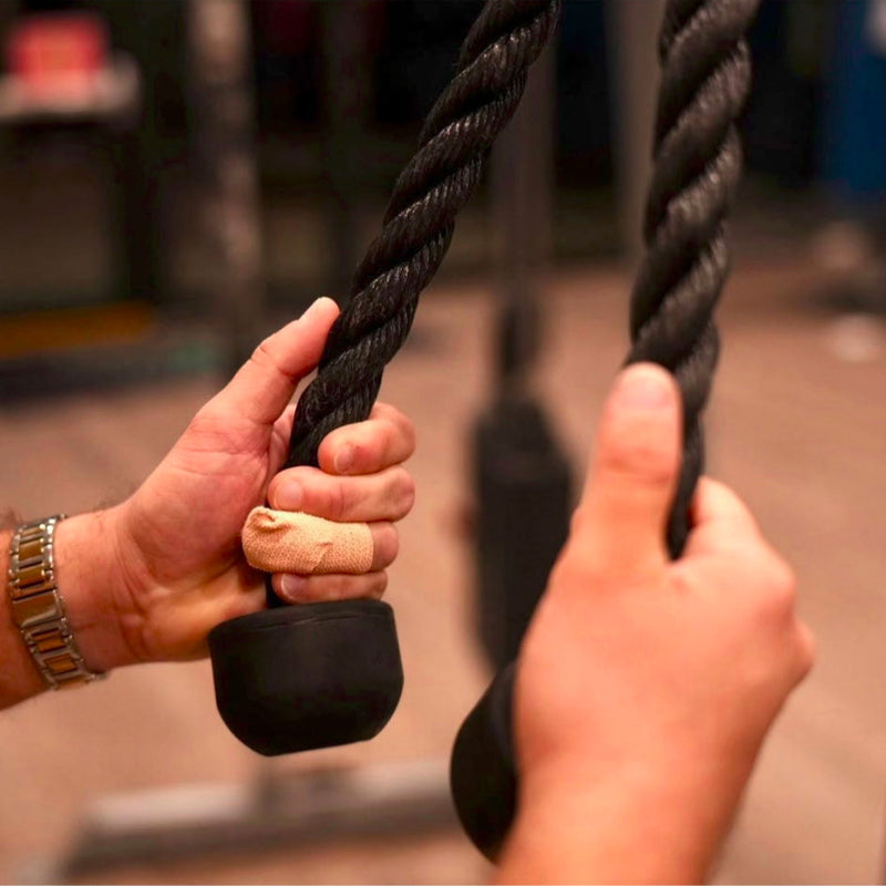 Hand holding a rope with text overlay on a social media platform